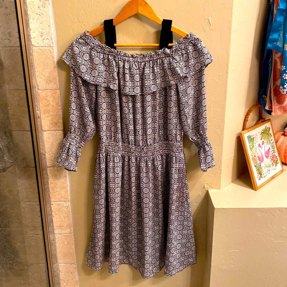 Cold-shoulder dress with bell sleeves.